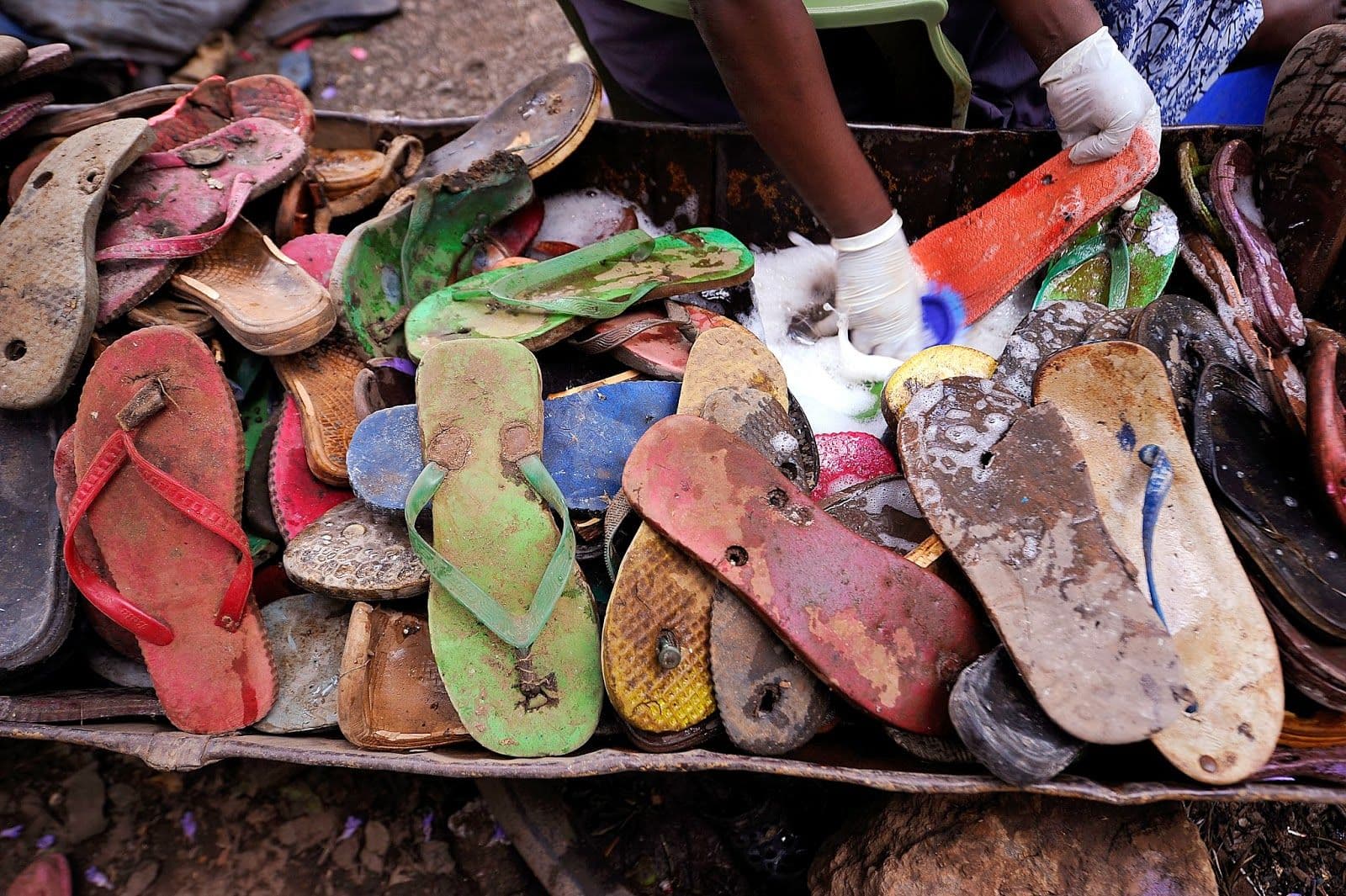 Workers Carve Toy Animals Made From Pieces Of Discarded Flip Flops At The Ocean Sole Flip Flop Recycling Company In Nairobi (1)